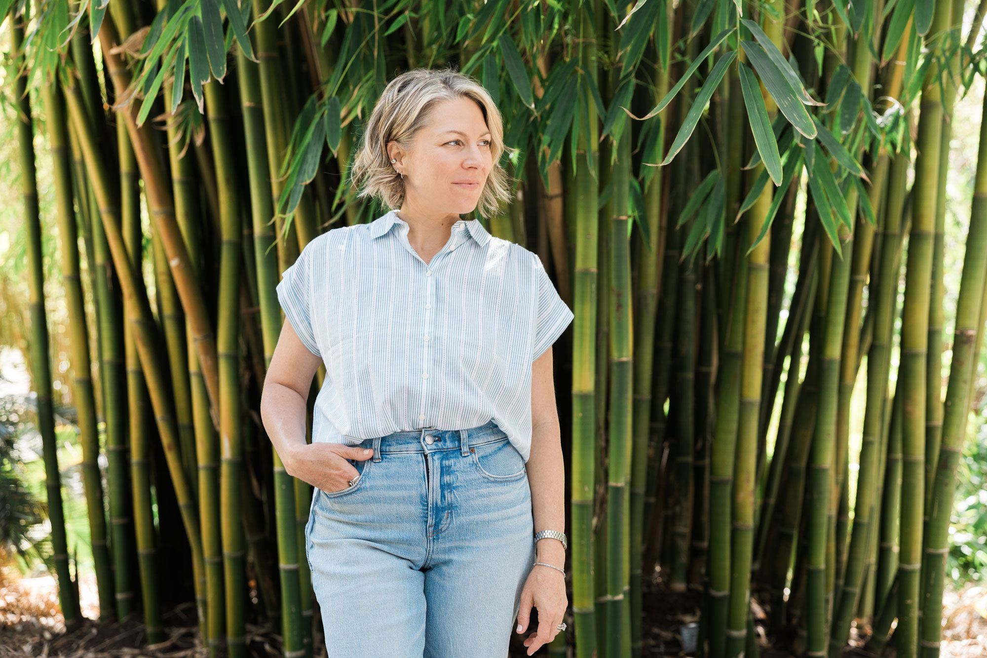 Kikki Avila standing among bamboo